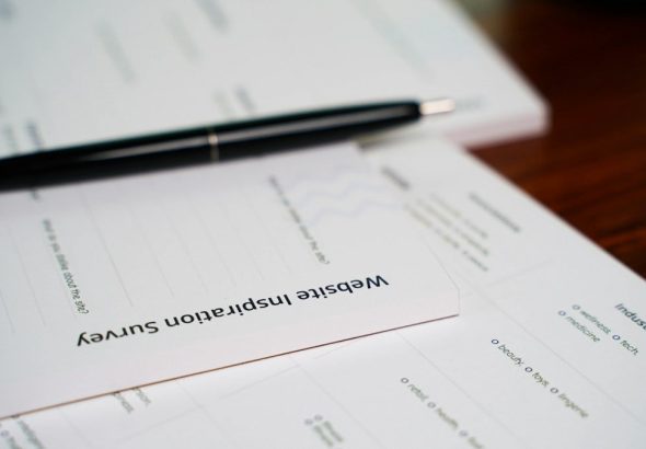 a pen sitting on top of a piece of paper